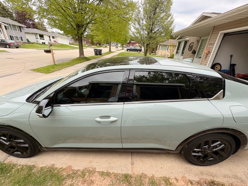 Mint green 2025 Kia K4 with dark ceramic window tint