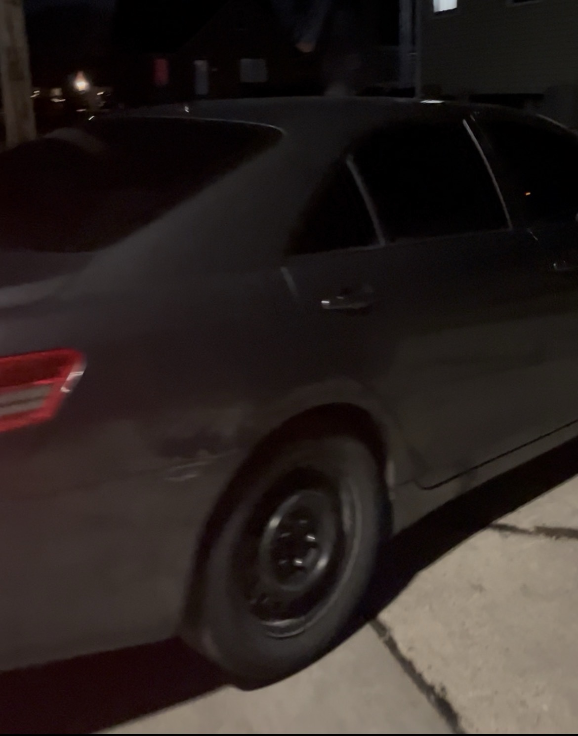 Toyota Camry at night with fresh window tint