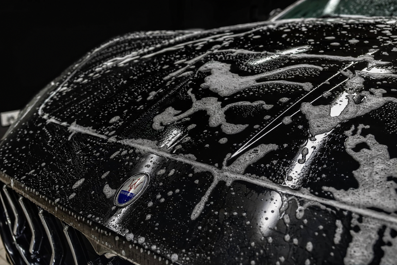 Luxury car exterior during maintenance wash